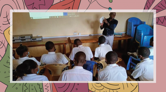 Image of young students listening to their instructor making a presentation at the head of the classroom.