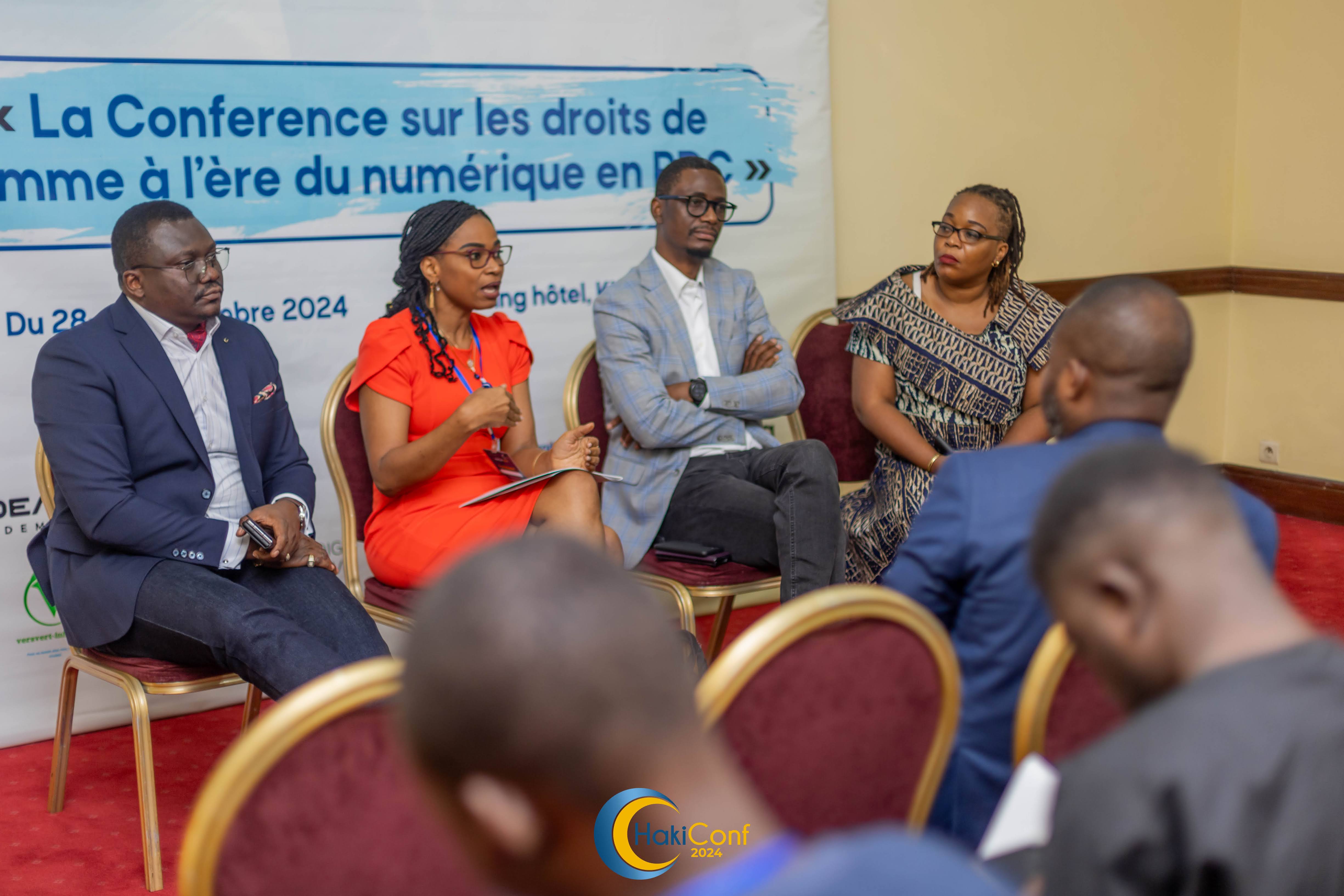 Image of four panellists engaged in a presenation at HakiConf 2024 in Kinshasa.