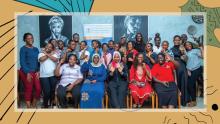 A group of 25 participants of WOUGNET's workshop post together for a celebratory photo.