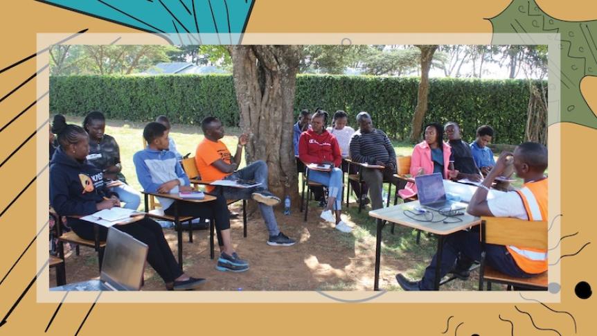 People gather at a community networking activity in Kenya. They are sitting on school chairs in an outdoor space. 