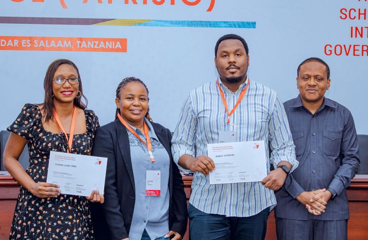 Peninah Susan Igaga and Audace Niyonkuru receive the Makane Faye AfriSIG Award. Photo: Courtesy of Hugo Domingo.