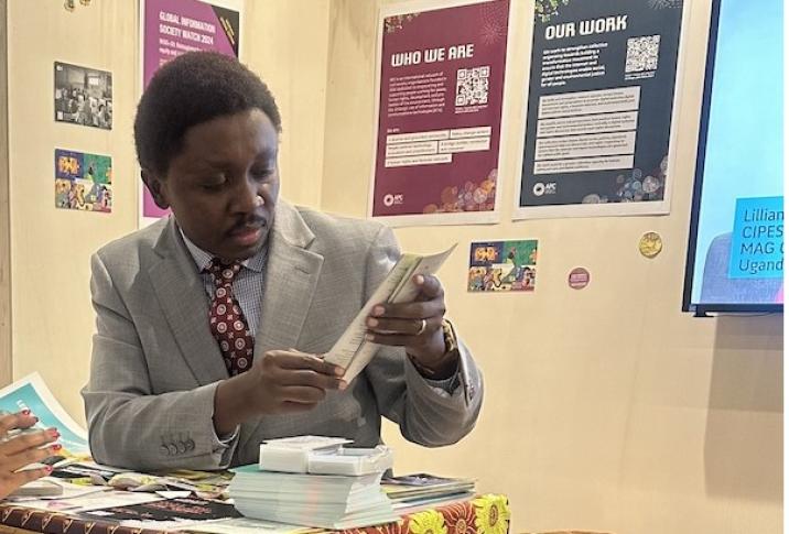 Arsène Tungali at the APC booth during IGF 2025