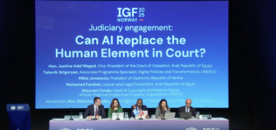 Five people sitting side by side at a table during an IGF session that year. image linking to Working towards an open, safe and rights-respecting internet 